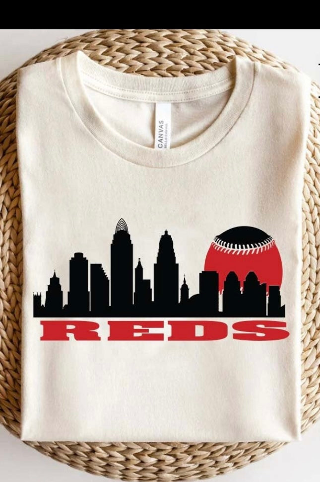 BLACK SKYLINE OVER REDS